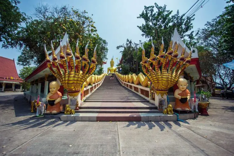 A staircase leads to the Buddha statue